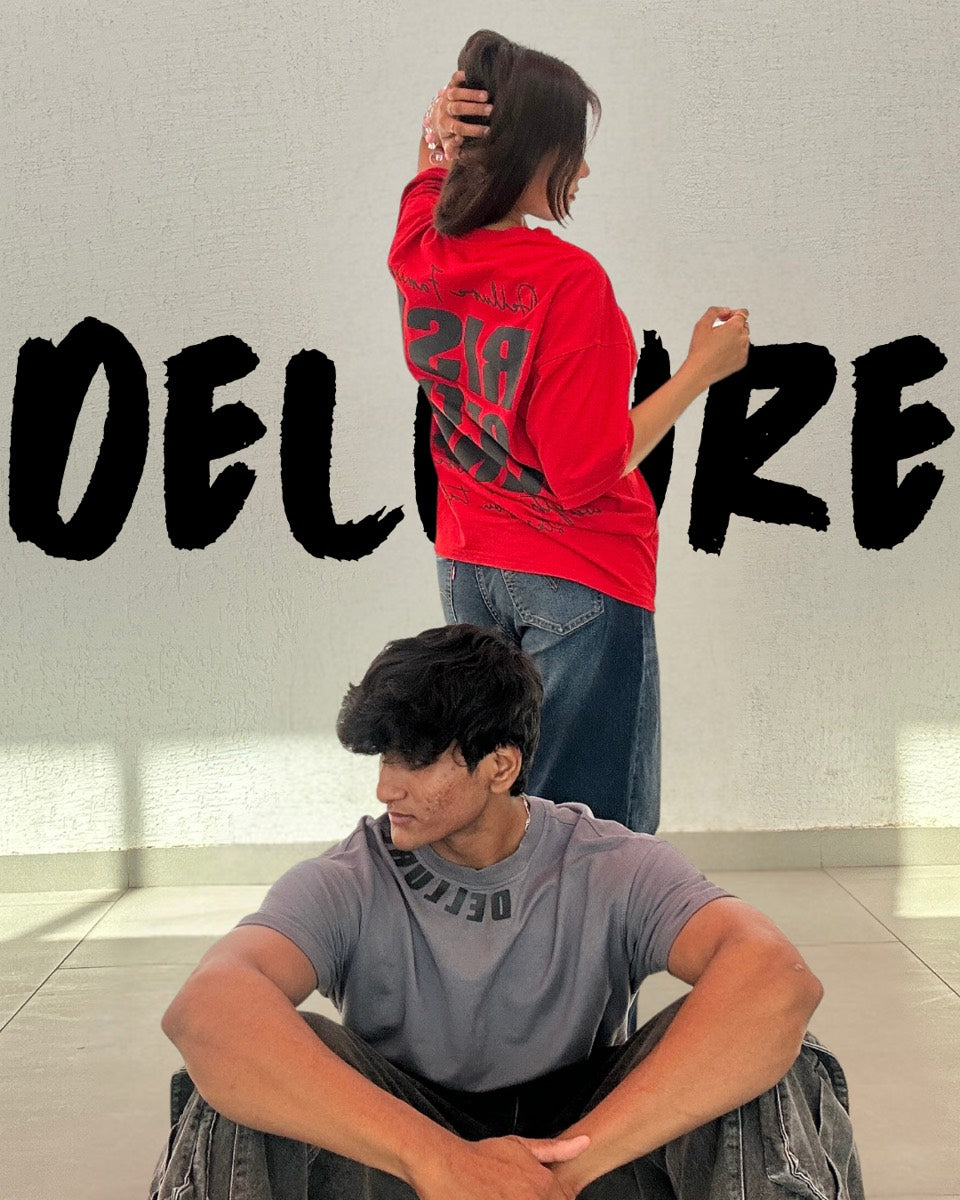 Two models in Dellure oversized t-shirts, red and grey Rise of the King print